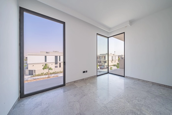 Bright, Minimalist Bedroom or Office Space in a Modern Villa with Exterior View